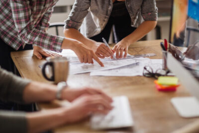 close-up-of-freelancers-hands-working-by-desk