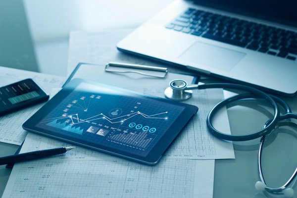 healthcare-business-concept-medical-examination-and-growth-graph-data-of-business-on-tablet-with-doctors-health-report-clipboard-on-background-